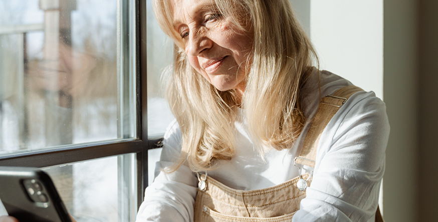 Old woman looking at phone